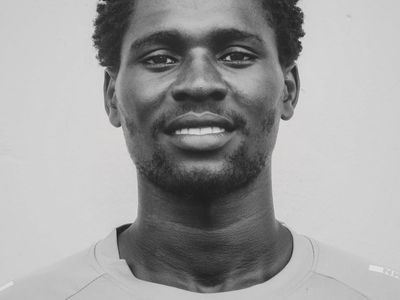 Close-up of a man's focused expression during a challenging exercise.